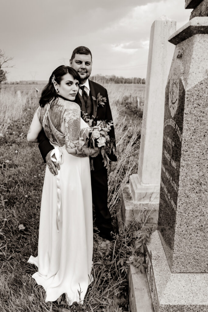 bride and groom in graveyard