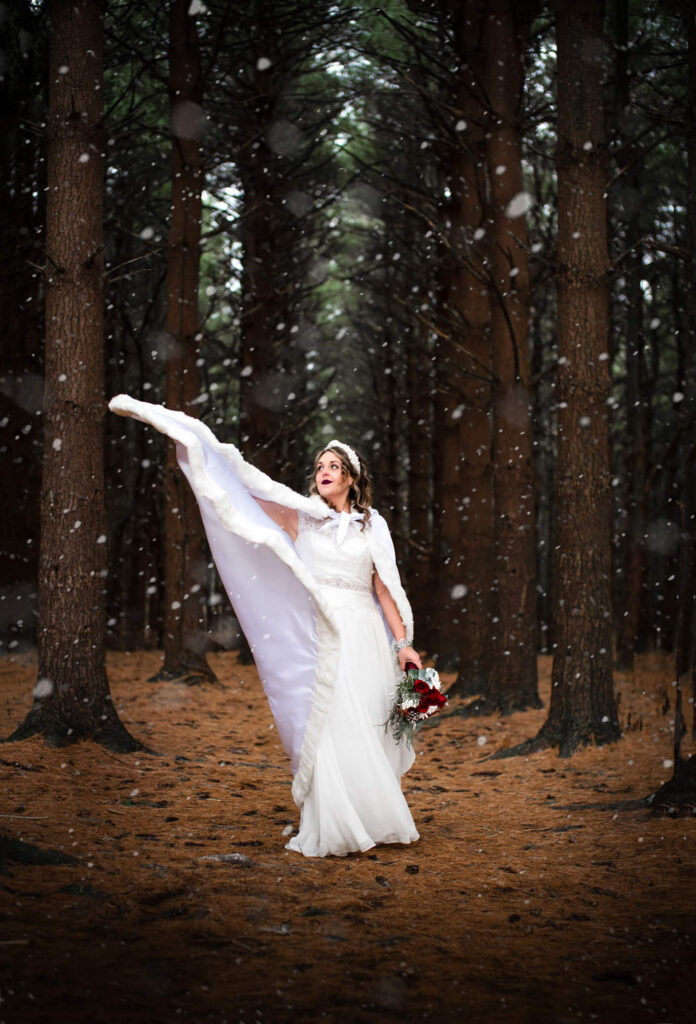 bride in snow at wedding