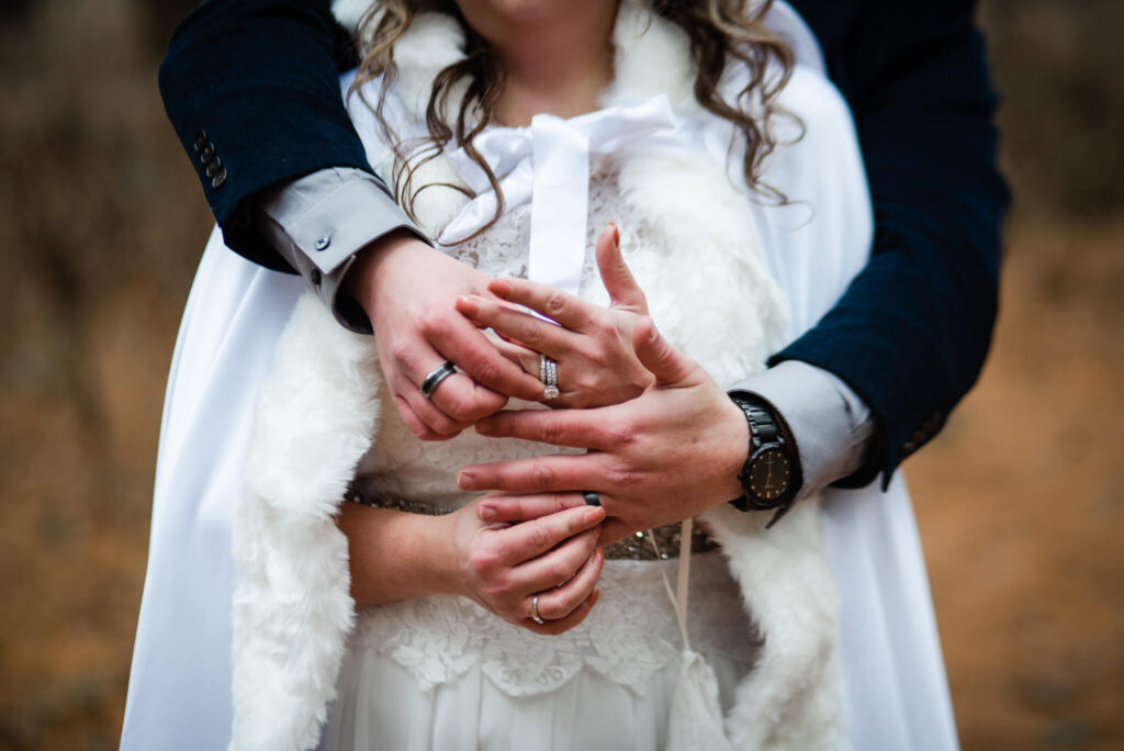 bride and groom exchange rings at wedding