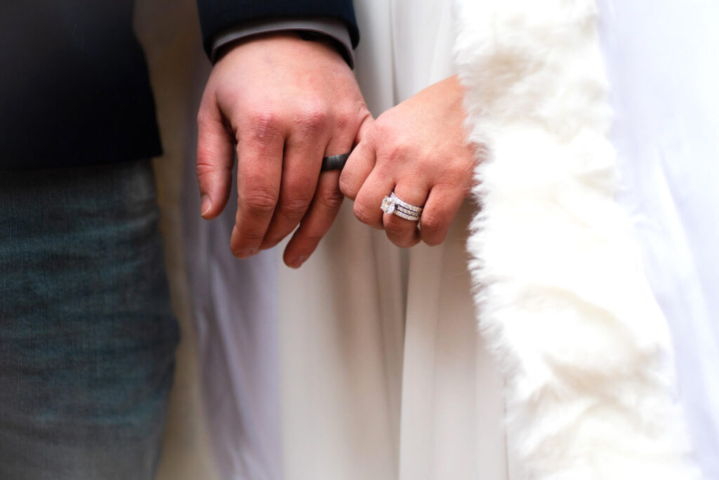 bride and groom hands at wedding