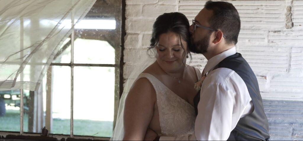 groom kissing bride